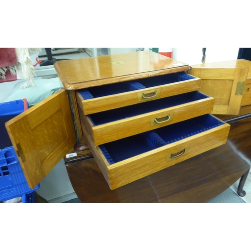 407 - A late Victorian oak canteen box with two doors, enclosing three drawers  11