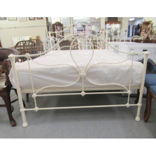 41 - A Laura Ashley Victorian style cream coloured iron framed double bed with a slatted base and mattres... 