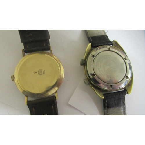 45 - A Favre-Leuba of Geneve Seabird wristwatch, faced by a baton dial, on a black hide strap; and a 9ct ... 