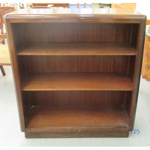 66 - A 20thC mahogany open front two tier bookcase, on a plinth  40