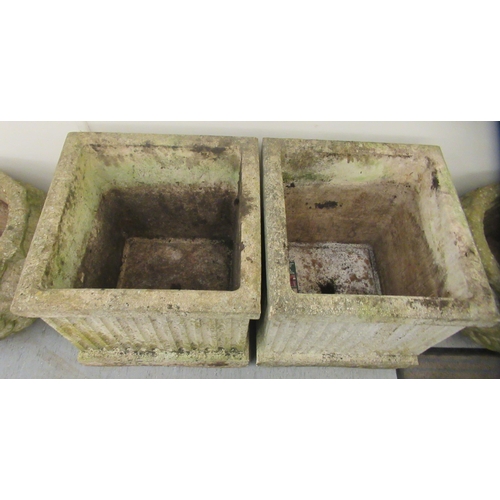 70 - A pair of composition stone planters of box design with fluted ornament  18