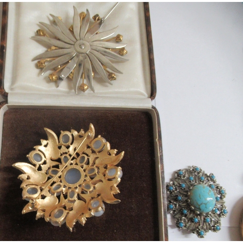 72 - 20thC items of personal ornament and pocket watches: to include a Trifari brooch; and a gold plated ... 