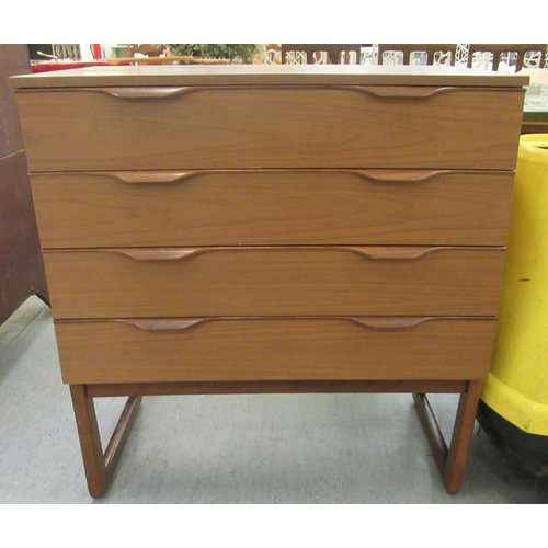 75 - A Europa Furniture teak finished four drawer dressing chest, raised on splayed feet  32