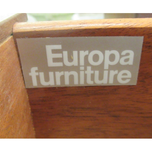 75 - A Europa Furniture teak finished four drawer dressing chest, raised on splayed feet  32