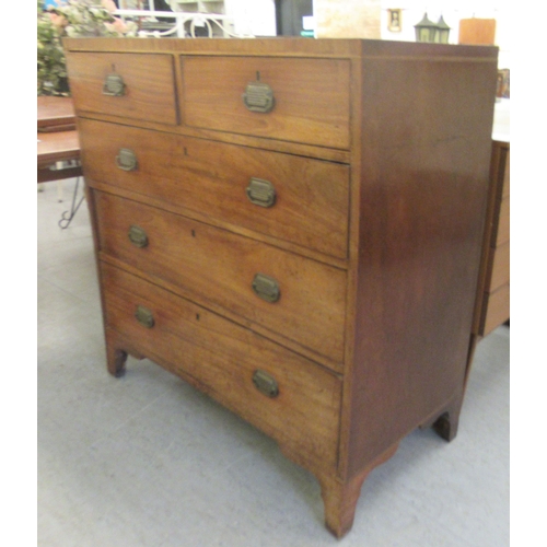 76 - A 19thC mahogany dressing chest with two short/three graduated long lockable drawers with brass bail... 