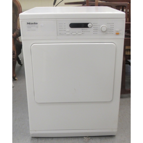 84 - A Miele T8722 vented tumble dryer  33.5