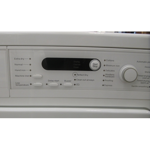 84 - A Miele T8722 vented tumble dryer  33.5