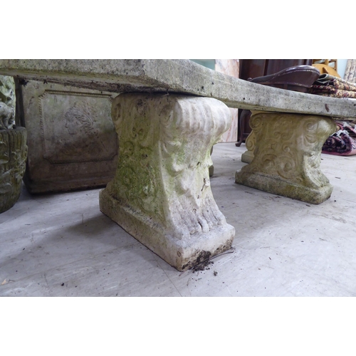 119 - A composition stone terrace bench, the curved seat raised on two pedestals  17