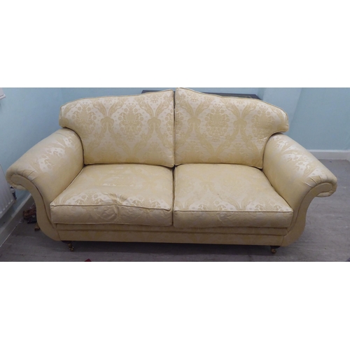 164 - A modern Omega Furniture three person settee, upholstered in patterned cream coloured fabric, raised... 