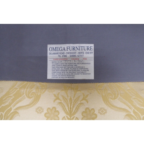 164 - A modern Omega Furniture three person settee, upholstered in patterned cream coloured fabric, raised... 