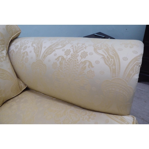 165 - A modern Omega Furniture three person settee, upholstered in patterned cream coloured fabric, raised... 