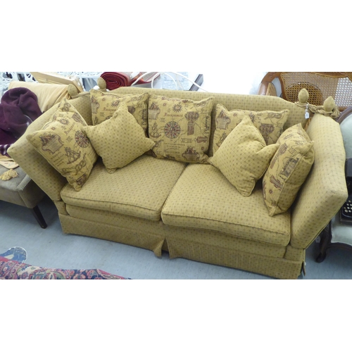 404 - A modern three person, drop-end settee, upholstered in a biscuit coloured fabric, on casters  78