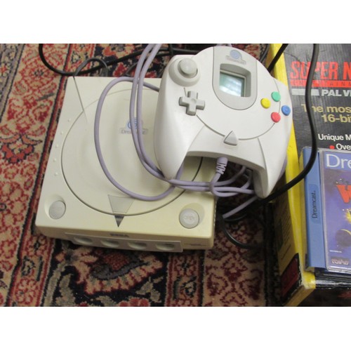 274 - A Super Nintendo entertainment system; and a Sega Dreamcast with three games and one controller