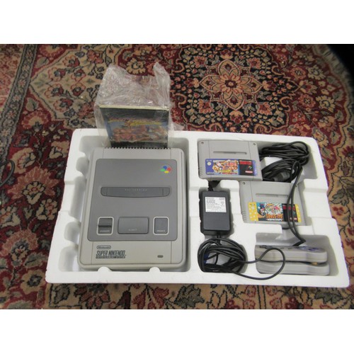 274 - A Super Nintendo entertainment system; and a Sega Dreamcast with three games and one controller