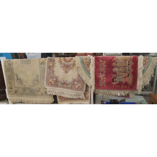 78 - Four similar small Chinese wash rugs  various sizes