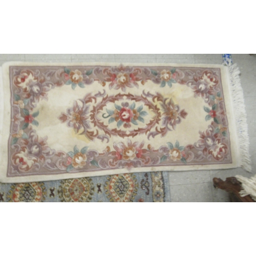 78 - Four similar small Chinese wash rugs  various sizes