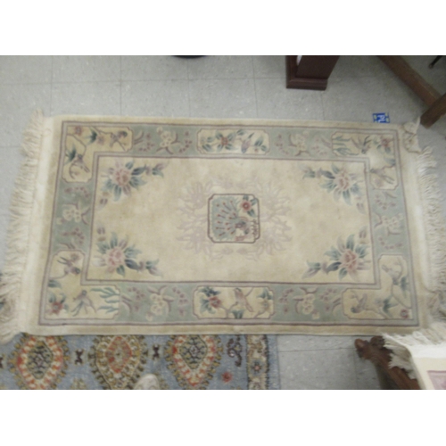 78 - Four similar small Chinese wash rugs  various sizes