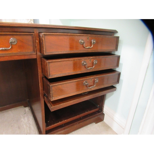 98 - A modern mahogany, one piece, single pedestal desk, on a plinth  31