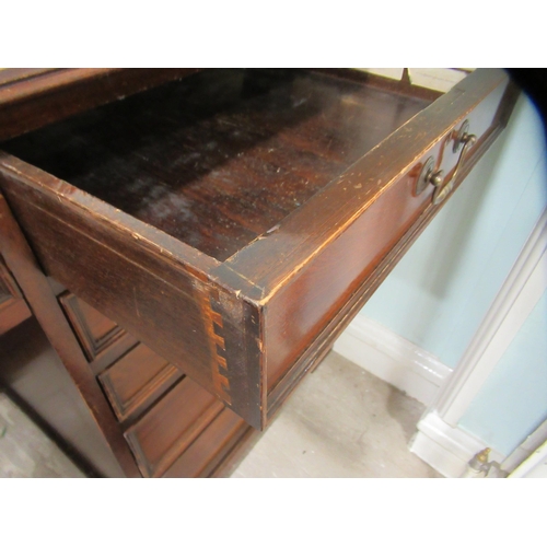 98 - A modern mahogany, one piece, single pedestal desk, on a plinth  31