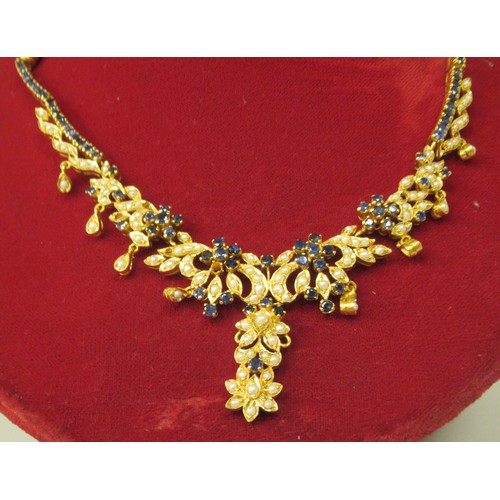 315 - A bespoke yellow metal (probably 22ct gold) suite of jewellery, set with sapphires and seed pearls, ... 