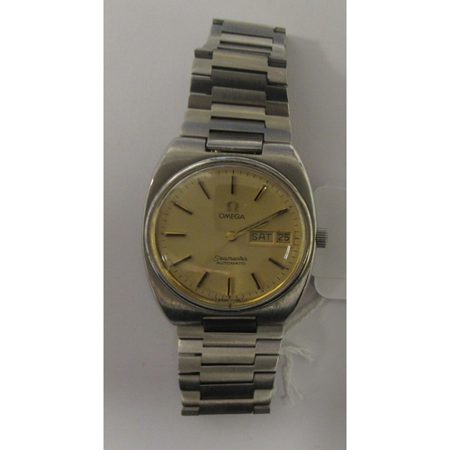 100 - A vintage Omega Seamaster automatic stainless steel cased bracelet watch, faced by a gilt baton dial... 