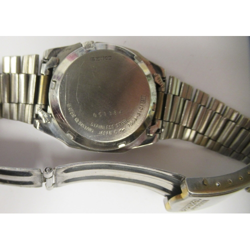 103 - A vintage Seiko 5 automatic stainless steel cased bracelet watch, faced by a gilt baton dial with a ... 