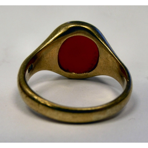 12 - A 9ct gold signet ring, set with an amber coloured stone