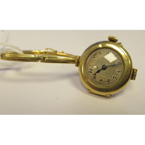 16 - A lady's early 20thC 18ct gold wristwatch, faced by an Arabic dial, on an expandable strap