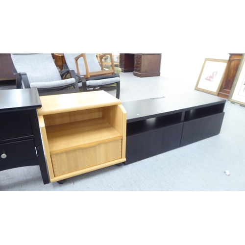 284 - Small furniture: to include a pair of black painted, two drawer bedside chests, raised on bracket fe... 