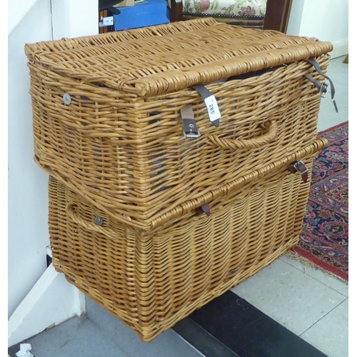 285 - Two similar woven cane picnic hampers with mixed contents