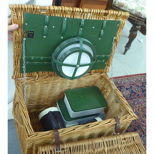 285 - Two similar woven cane picnic hampers with mixed contents