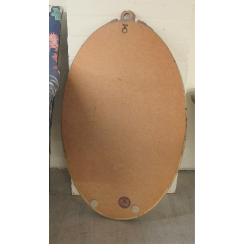 287 - A modern oval bevelled mirror, set in a moulded gilt frame  31