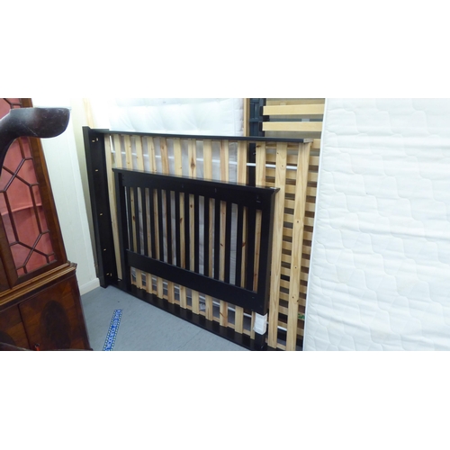 289 - A Marks & Spencer black painted bed frame 55