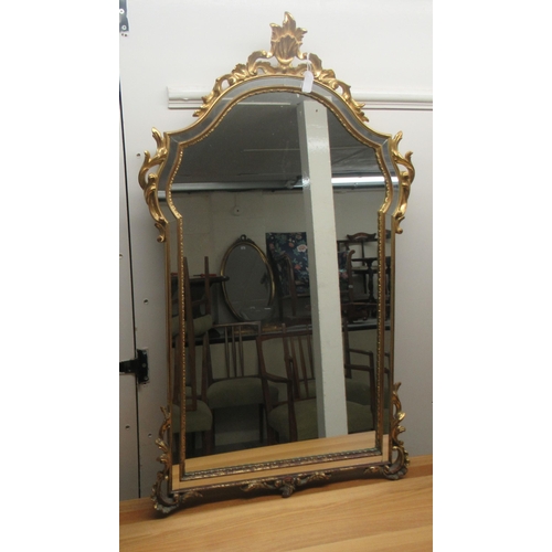 291 - A modern mirror, the arched plate with separate margin slips, set in an ornate gilt frame  42