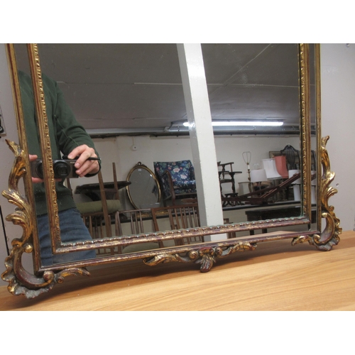 291 - A modern mirror, the arched plate with separate margin slips, set in an ornate gilt frame  42