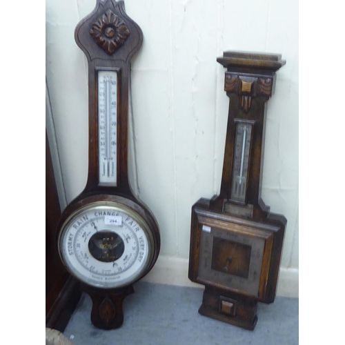 294 - Two similar 1920s/1930s oak framed barometers, each with an Arabic dial  31