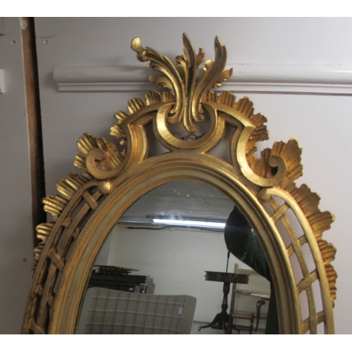 296 - A modern oval mirror, set in an ornate gilt frame  38