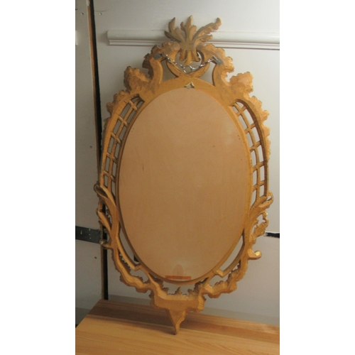 296 - A modern oval mirror, set in an ornate gilt frame  38