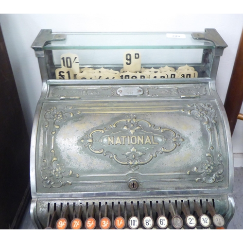 299 - An early 20thC National counter-top cash register with decoratively cast floral ornamentation, a pri... 