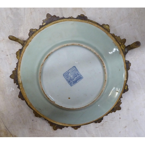 309 - A mixed lot: to include a Chinese Celadon plate, set in an ornate gilt metal frame  7