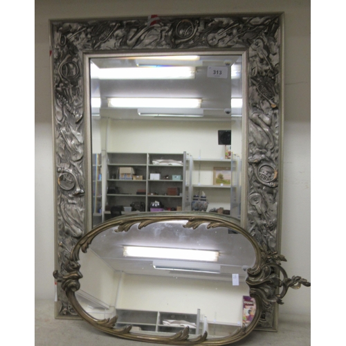 313 - Mirrors: to include an example in a silver painted frame, carved with musical instruments  24