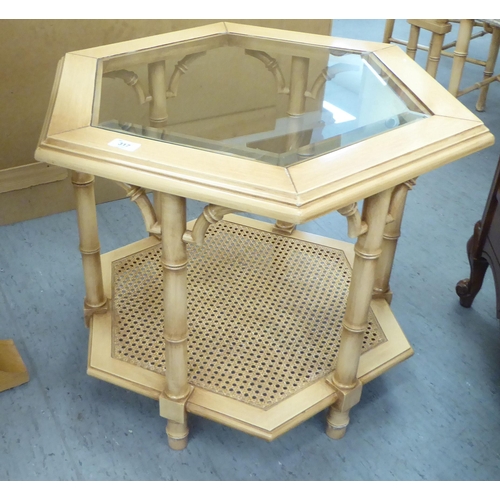 317 - A modern bamboo effect coffee table with a glass top, raised on cluster legs  24