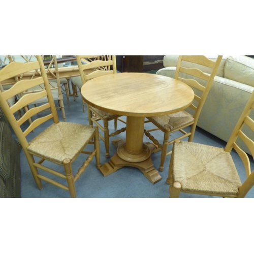 322 - A modern light oak breakfast table, raised on a pedestal base  30