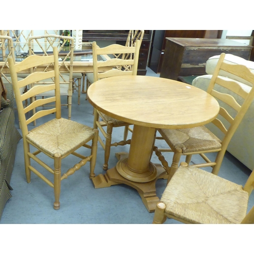 322 - A modern light oak breakfast table, raised on a pedestal base  30