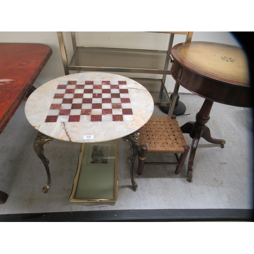 323 - Small modern furniture: to include a coffee table, the chessboard marble top raised on cast brass ca... 