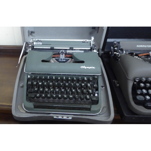 36 - A vintage Remington Rand portable typewriter; and an Olympia