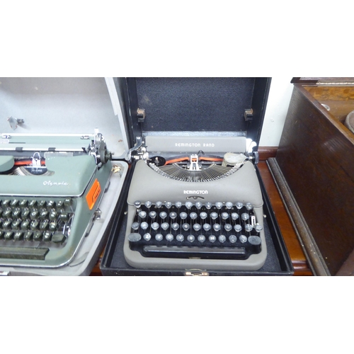 36 - A vintage Remington Rand portable typewriter; and an Olympia