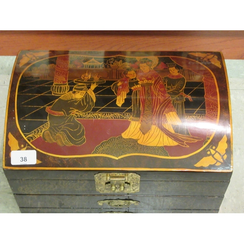 38 - A Mah-jong set, contained in a black lacquered and printed chest with a hinged, domed lid and straig... 