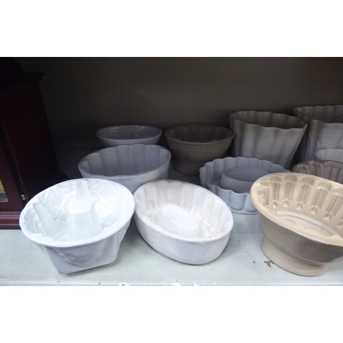 39 - Eleven 19thC and later, china and other variously designed jelly moulds  mixed sizes