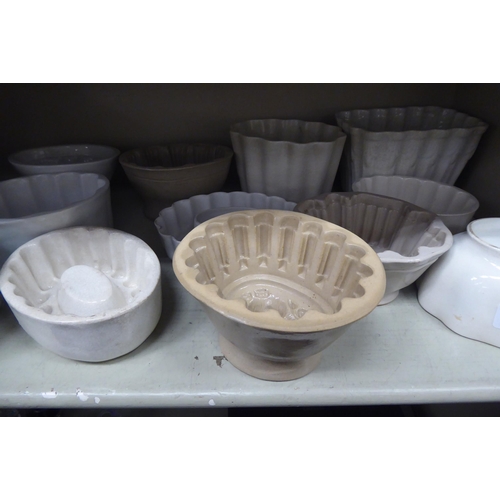 39 - Eleven 19thC and later, china and other variously designed jelly moulds  mixed sizes